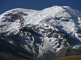 Ecuador Chimborazo 02-02 Estrella del Chimborazo Chimborazo Closer View Chimborazo's majestic summit rises 2500m above the surrounding highlands. The top of Chimborazo is completely covered by glaciers with some north-eastern glacier arms flowing down to 4600m. With an elevation of 6310m, Chimborazo is just one degree south of the equator and the earth's diameter at the equator is greater than at Everest's latitude (nearly 28� north), with sea level also being elevated. So, despite being 2540m lower in elevation above sea level, it is 6384km from the Earth's center, 2.1 km farther than the summit of Everest.